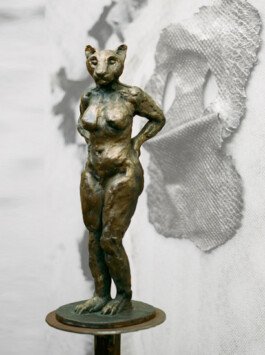 Bronze sculpture gatekeepers chloe valorso lion woman side view 